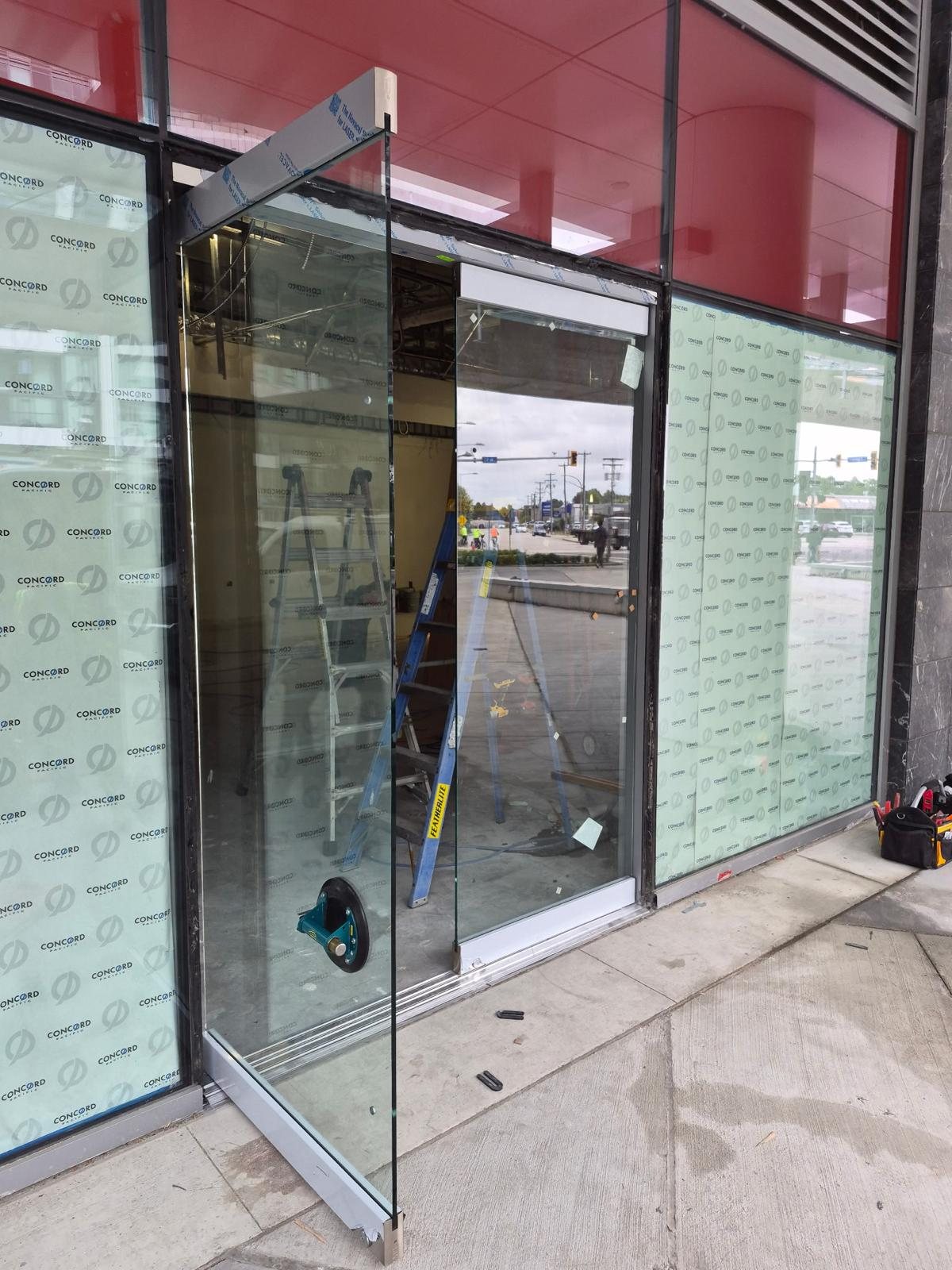 Commercial storefront glass door installation