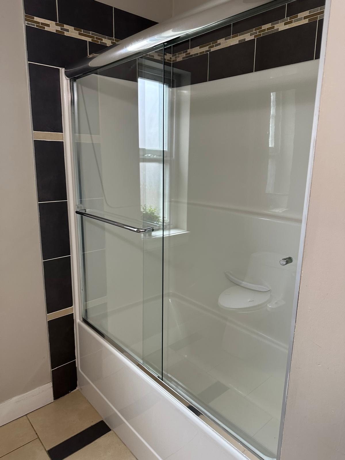 Sliding glass shower door installation